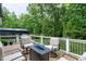 Cozy deck area with comfortable seating around a fire pit, ideal for enjoying evenings outdoors at 168 E Deer, Apex, NC 27523