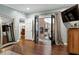 Elegant entryway with hardwood floors leading to a sunroom through double doors at 168 E Deer, Apex, NC 27523
