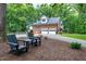 Brick home boasts a two-car garage, basketball hoop, and charming landscaping at 168 E Deer, Apex, NC 27523