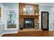 Close-up of the brick fireplace with decorative details at 168 E Deer, Apex, NC 27523