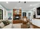 Cozy brick fireplace with decorative mantle in the living room at 168 E Deer, Apex, NC 27523