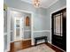 Warm and inviting foyer with hardwood floors and decorative trim at 168 E Deer, Apex, NC 27523