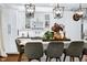 Bright kitchen featuring a marble island with counter seating and modern pendant lighting at 168 E Deer, Apex, NC 27523