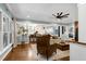 Open living room provides hardwood floors and views to the kitchen with a decorative tree feature at 168 E Deer, Apex, NC 27523