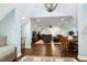 Open-concept living room with hardwood floors, comfortable seating, and stylish decor at 168 E Deer, Apex, NC 27523