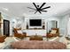 Bright living room with ceiling fan, comfortable furniture and ample space at 168 E Deer, Apex, NC 27523