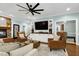 Stylish living room with custom built-ins and abundant natural light at 168 E Deer, Apex, NC 27523