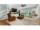 Open-concept living room with lots of windows providing an abundance of natural light at 168 E Deer, Apex, NC 27523