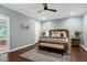 Bedroom features a king bed, bench, wood furnishings, and a peaceful atmosphere at 168 E Deer, Apex, NC 27523