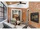 The sunroom features a cozy seating area, fireplace, and access to the bedroom at 168 E Deer, Apex, NC 27523
