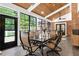 Sunroom with multiple windows, wood ceilings, and a dining table for gatherings at 168 E Deer, Apex, NC 27523