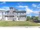 Well-maintained townhouse featuring a lush backyard with lawn, a cozy patio, and secure black metal fencing at 172 Wellons Creek Dr, Garner, NC 27529