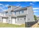 A fenced backyard featuring healthy green lawn, newly painted light gray vinyl siding, and private outdoor space at 172 Wellons Creek Dr, Garner, NC 27529