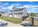 New townhouse with green grass, a small patio, black metal fence and access to walking paths at 172 Wellons Creek Dr, Garner, NC 27529