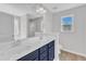 Bright bathroom with dual sink vanity, lots of counterspace, and large mirror at 172 Wellons Creek Dr, Garner, NC 27529