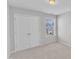 Neutral bedroom with a double closet and a window at 172 Wellons Creek Dr, Garner, NC 27529