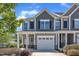 Charming townhome with stylish architectural details and an attached one-car garage at 172 Wellons Creek Dr, Garner, NC 27529