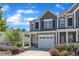 Attractive townhome featuring a one-car garage and an inviting front porch area at 172 Wellons Creek Dr, Garner, NC 27529