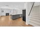 Open-concept kitchen with large center island and wood flooring at 172 Wellons Creek Dr, Garner, NC 27529