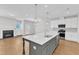 Bright, spacious kitchen with stainless appliances and large island at 172 Wellons Creek Dr, Garner, NC 27529