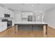 Bright kitchen featuring white cabinetry, stainless steel appliances, and a large center island at 172 Wellons Creek Dr, Garner, NC 27529