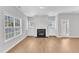 Spacious living room with fireplace, built-in cabinets, and ample natural light at 172 Wellons Creek Dr, Garner, NC 27529