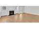 Open-concept living room with fireplace, built-in cabinets, and view of outdoor access at 172 Wellons Creek Dr, Garner, NC 27529