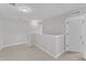 Upstairs loft features neutral carpeting and multiple doorways to the bedrooms and other areas at 172 Wellons Creek Dr, Garner, NC 27529