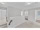 Loft area with access to the laundry room and bedrooms on the second level of the home at 172 Wellons Creek Dr, Garner, NC 27529