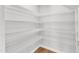 Walk-in pantry featuring ample shelving space at 172 Wellons Creek Dr, Garner, NC 27529
