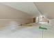 An unfinished attic with wood floors, a ceiling fan, and access to other rooms awaits customization at 1732 Bobwhite Ln, Rocky Mount, NC 27804