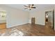 A spacious bedroom features hard wood floors, neutral walls, and a ceiling fan for comfortable living at 1732 Bobwhite Ln, Rocky Mount, NC 27804