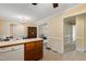 Spacious kitchen with view into living room and classic wood cabinetry at 1732 Bobwhite Ln, Rocky Mount, NC 27804