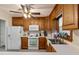 Kitchen featuring white appliances, wood cabinets, and ample countertop space at 1732 Bobwhite Ln, Rocky Mount, NC 27804