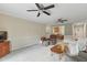 Bright living room with two ceiling fans and view into kitchen at 1732 Bobwhite Ln, Rocky Mount, NC 27804