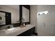Stylish bathroom features a double sink vanity, modern fixtures, and a walk-in shower at 1802 Pershing Rd, Raleigh, NC 27608
