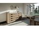 Charming Bedroom with a dresser, cute decorations, and a serene outdoor view at 1802 Pershing Rd, Raleigh, NC 27608