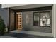 Close up of the front door with modern design elements and a window, showing the interior decorations at 1802 Pershing Rd, Raleigh, NC 27608