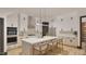 Modern kitchen features stainless steel appliances, a center island, and custom cabinetry at 1802 Pershing Rd, Raleigh, NC 27608