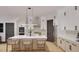 Bright kitchen includes stainless steel appliances, a center island, and custom cabinetry at 1802 Pershing Rd, Raleigh, NC 27608