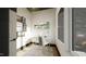 Bright home office with a modern desk, chair, shelving, and large window for natural light at 1802 Pershing Rd, Raleigh, NC 27608