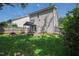 View of the backyard with patio, wooden fence, and green grass at 1910 Falls Landing Dr, Raleigh, NC 27614