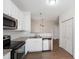 Kitchen featuring stainless steel appliances, granite countertops, and white cabinets at 1910 Falls Landing Dr, Raleigh, NC 27614