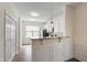 Bright kitchen features granite countertops, white cabinets, and stainless steel appliances at 1910 Falls Landing Dr, Raleigh, NC 27614