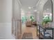 Bright hallway view showcasing an open floorplan, hardwood floors, and elegant interior design at 1913 Ballard Rd # 193, Fuquay Varina, NC 27526
