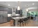 Open kitchen boasts stainless appliances, a large center island, and adjacent dining area at 1913 Ballard Rd # 193, Fuquay Varina, NC 27526