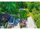 Aerial view of a home with a large yard, basketball court, patio, and detached garage at 2111 Woodland Ave, Raleigh, NC 27608