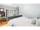 Light-filled bedroom featuring a ceiling fan, neutral walls, and a walk-in closet at 2111 Woodland Ave, Raleigh, NC 27608