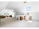 Bright and spacious bonus room featuring a desk, seating, and skylight at 2111 Woodland Ave, Raleigh, NC 27608