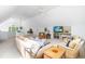 Spacious bonus room with comfortable seating, built-in shelving, and natural light at 2111 Woodland Ave, Raleigh, NC 27608